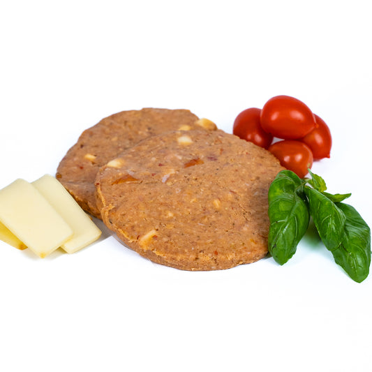 Hamburger di pollo con pesto, pomodorini e provola